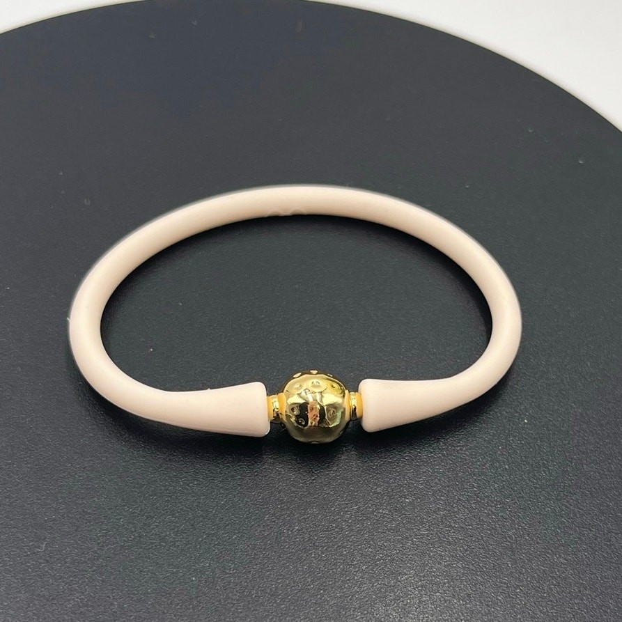 Gresham Florence Off White Silicone Water Resistant Hammered Gold Ball Bracelet gallery