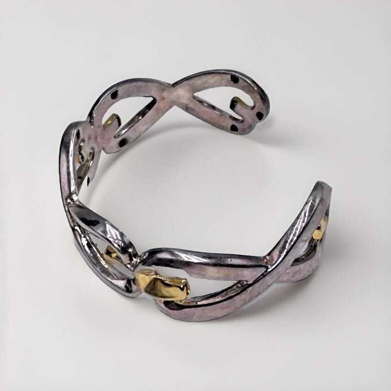 Vintage "BEST" Brand Silver And Gold Toned Open Work InFinity Cuffed Bracelet gallery
