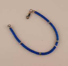 Lapis Lazuli 7.5 inch Smooth Navy Blue Beaded Bracelet with gold beads and clasp