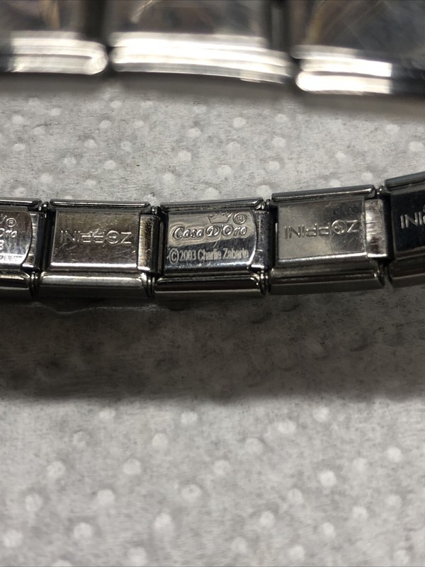 2003- CASA D'ORO ITALIAN STAINLESS STEEL 17 CHARM LINKS STRETCH BRACELET gallery