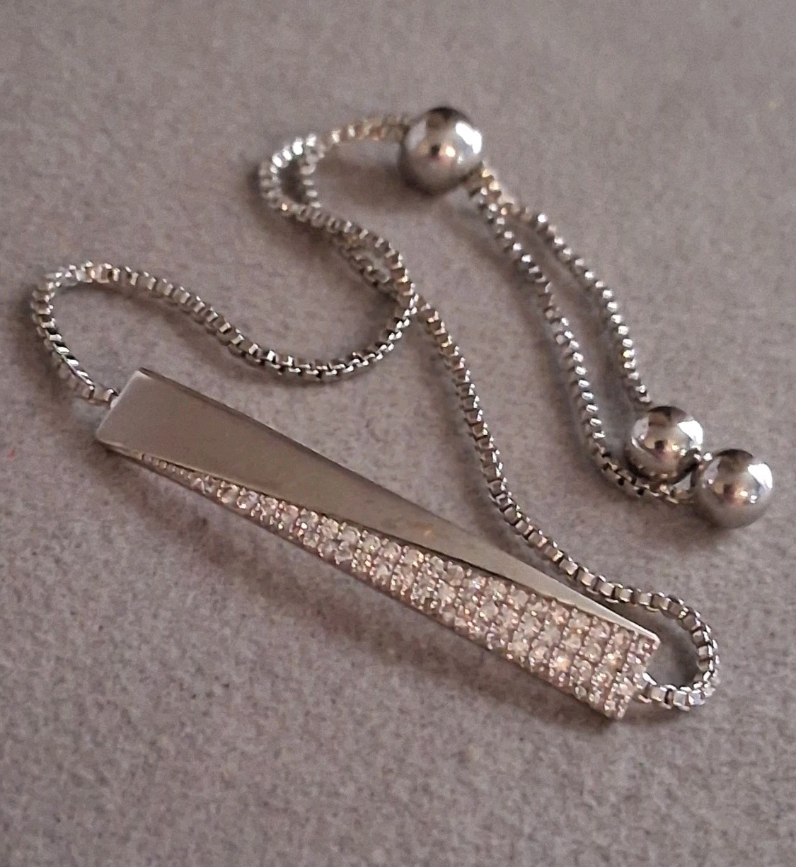 Silverplated bolo bracelet w/cubic zirconia pave-set accent stones. Adj. 7-8" gallery