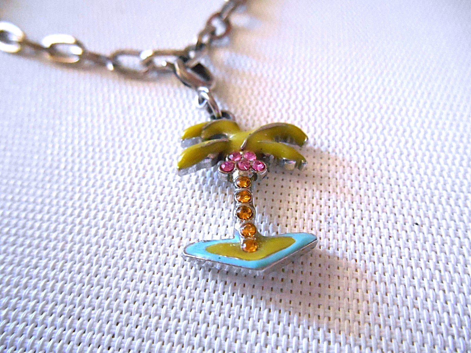 HIGH INTENCITY Silvertone Charm Bracelet with Palm Tree Charm gallery