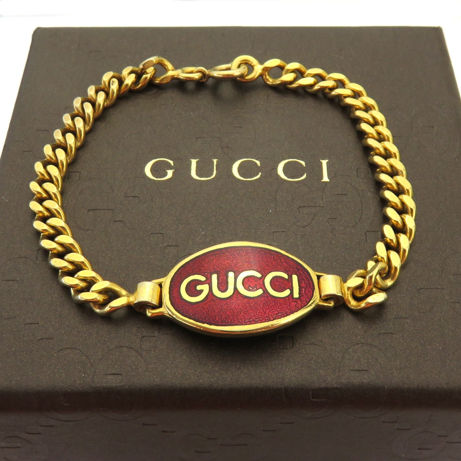 Gucci Vintage Gold Tone Metal Red Oval Tag Bracelet gallery