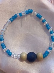 Teen/kid multicolored beaded bracelet; blue, white, brown, and purple