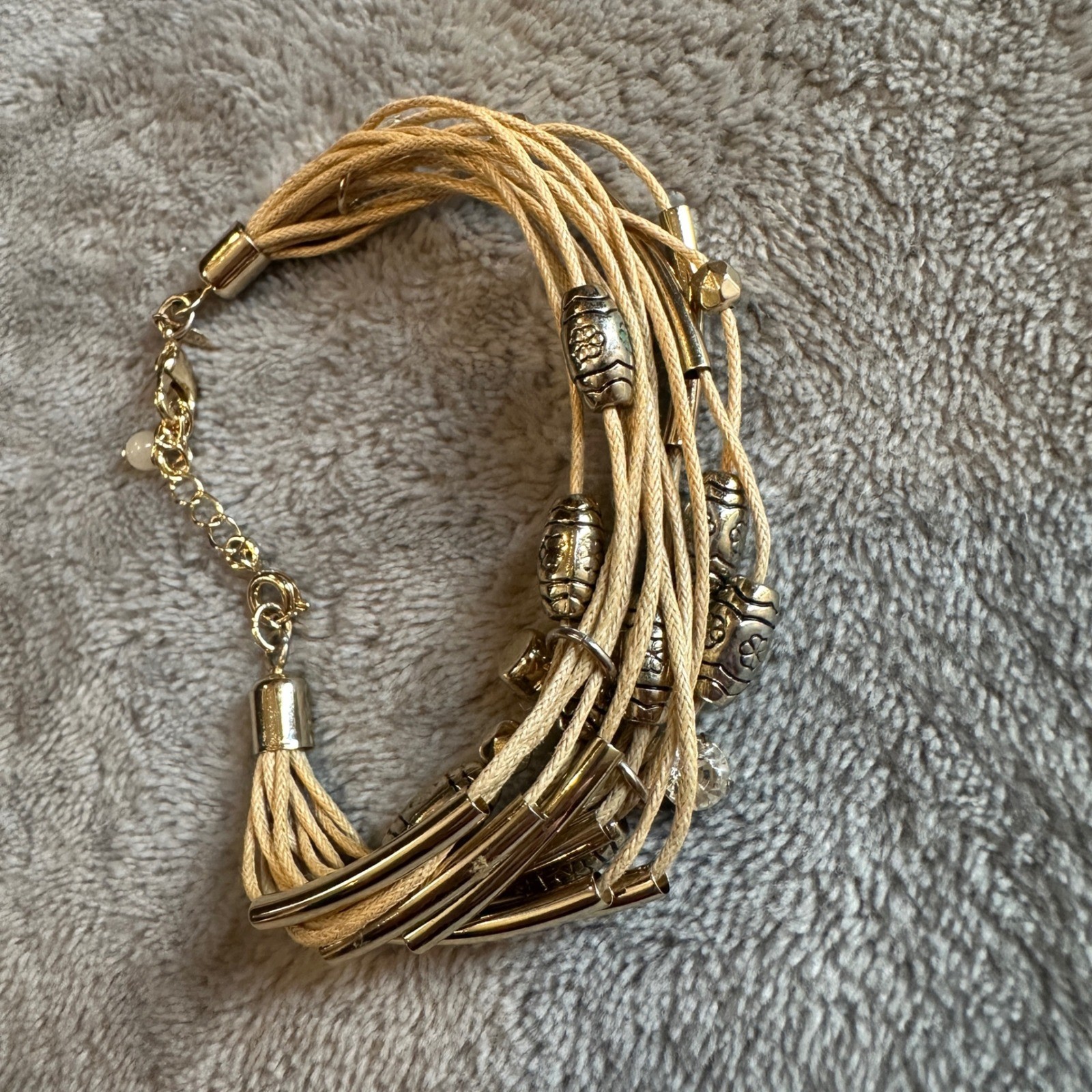 Boho Layered Cord Bracelet Silver Tone Charms Tassel Accent Gold Tone Clasp gallery