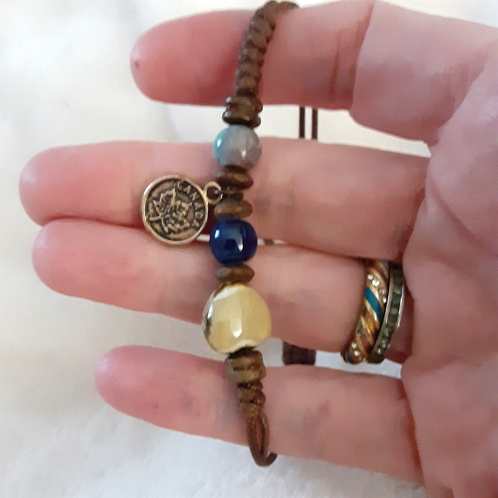 Handmade beaded string bracelet small Canada charm adjustable gallery