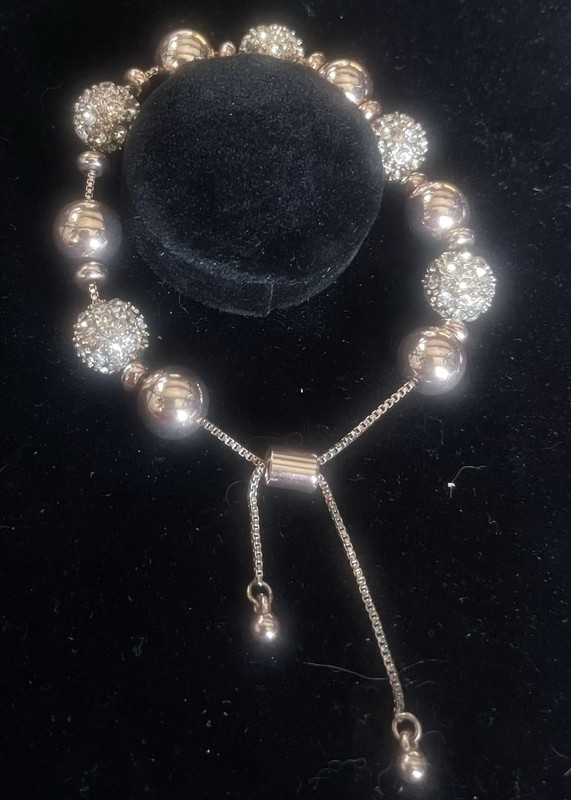 A Beaded Slider Bolo Bracelet With Alternatively Smooth Metallic Beads, Charms gallery