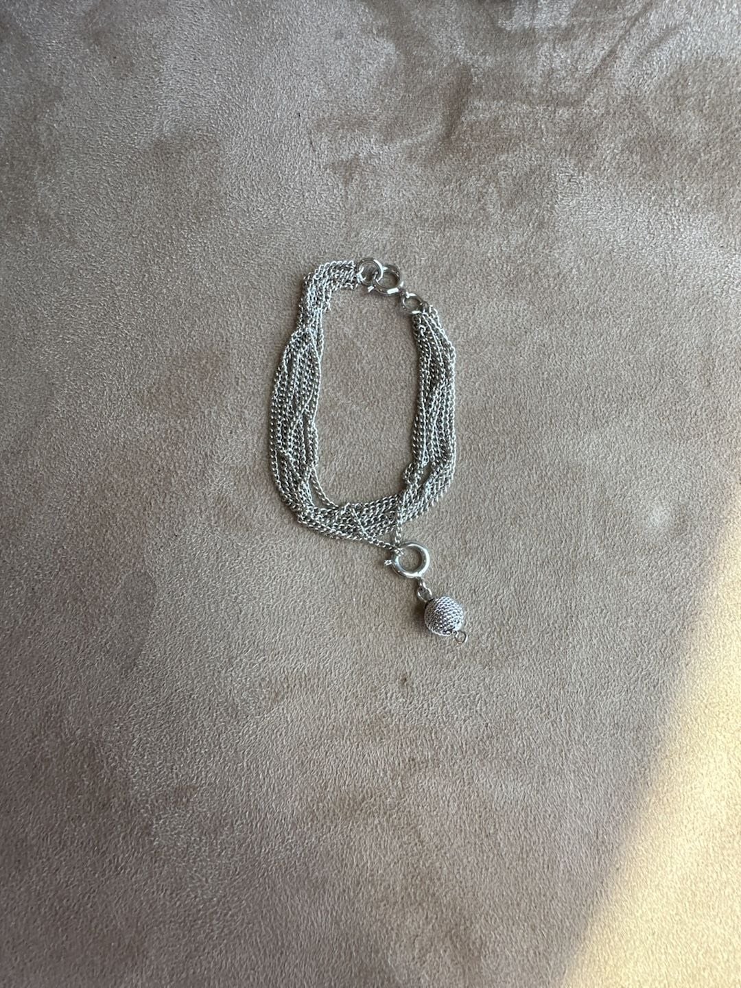 Multi-Strand Silver Tone Chain Bracelet with Textured Bead Charm gallery