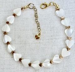 Mother-of-pearl Heart Bracelet,gold-tone heart accents.Lobster, 6.7″extends 7.5”