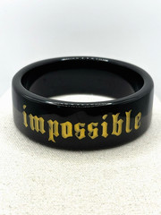 Black And Gold Stylized 3D Inscribed Redefine The Impossible Bangle Bracelet