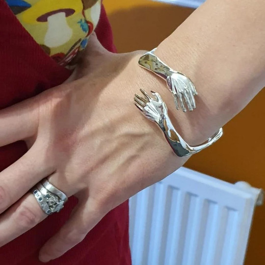 Hugging hands cuff bracelet