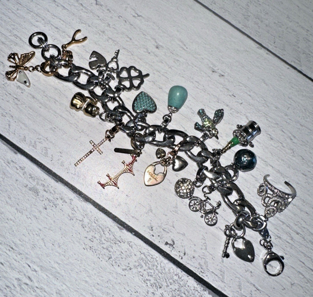 FOSSIL DESIGNER SILVERTONE CHARM BRACELET WITH 18 ASSORTED CHARMS gallery