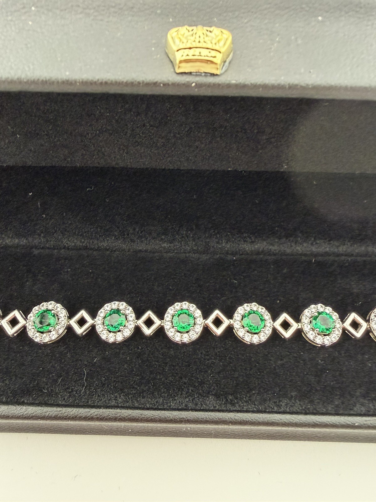 Woman’s Sterling silver .925 tennis bracelet with green and clear stones. gallery