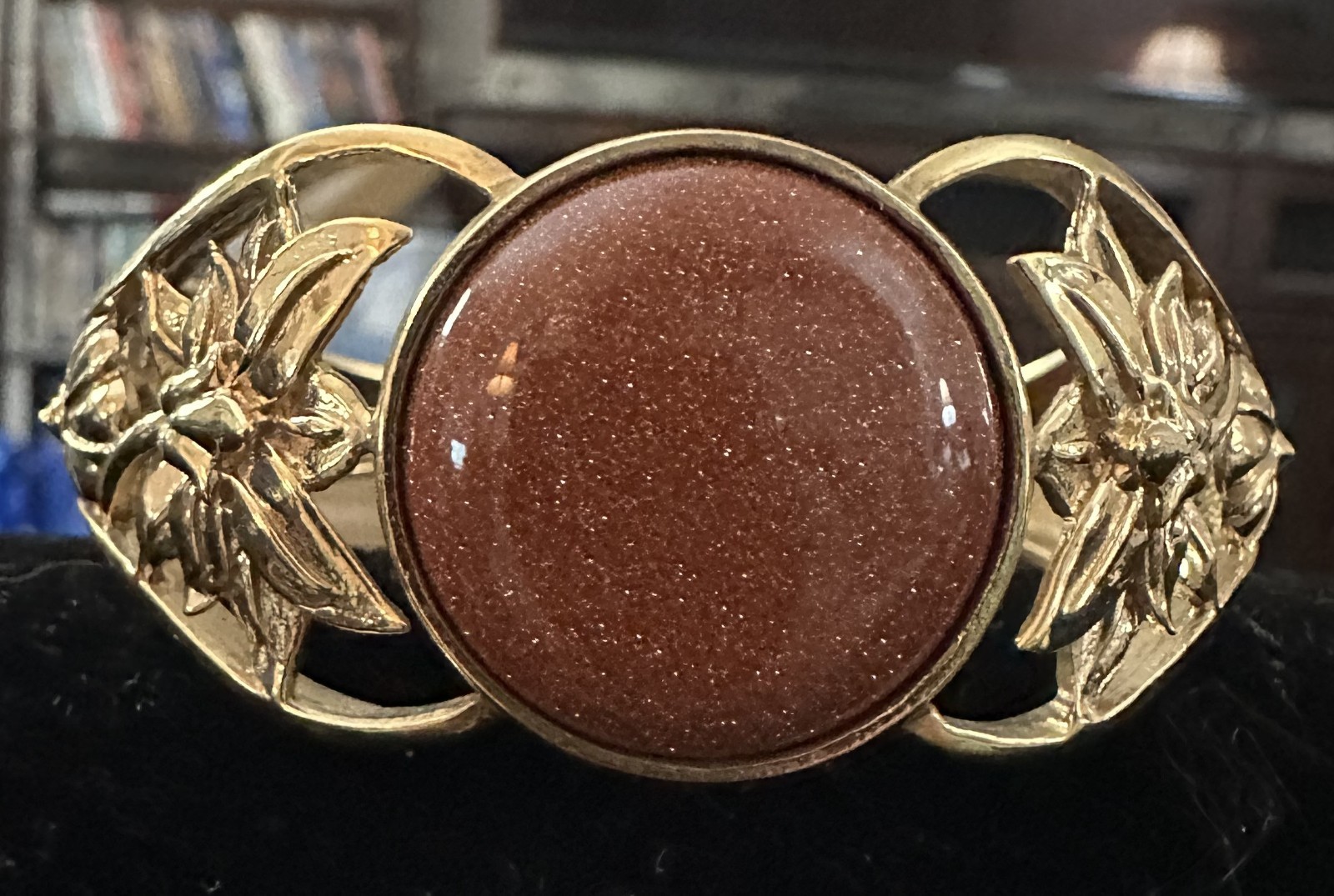 Bracelet - Goldstone Bangle - Bracelet measures 7 inches. The back is open gallery