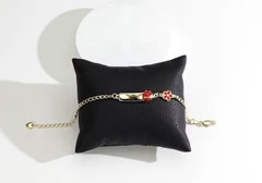 Gold-plated baby bracelet with enamel flower and ladybug charms. Gift Box