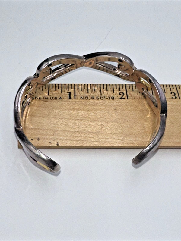 Vintage "BEST" Brand Silver And Gold Toned Open Work InFinity Cuffed Bracelet gallery