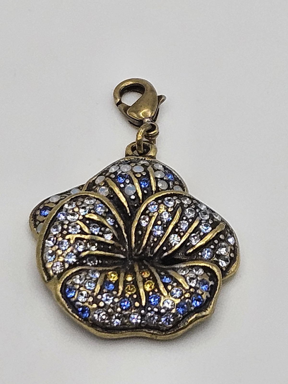 Heidi Daus Antiqued Brass Tone Blue Crystals Pansy Flower Dangle Charm gallery