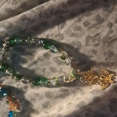 Green and Clear Glass Beaded Bracelet with Gold Dangle Butterfly Charms