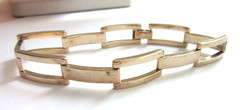 Gold tone high polished panther linked bracelet -8″ long