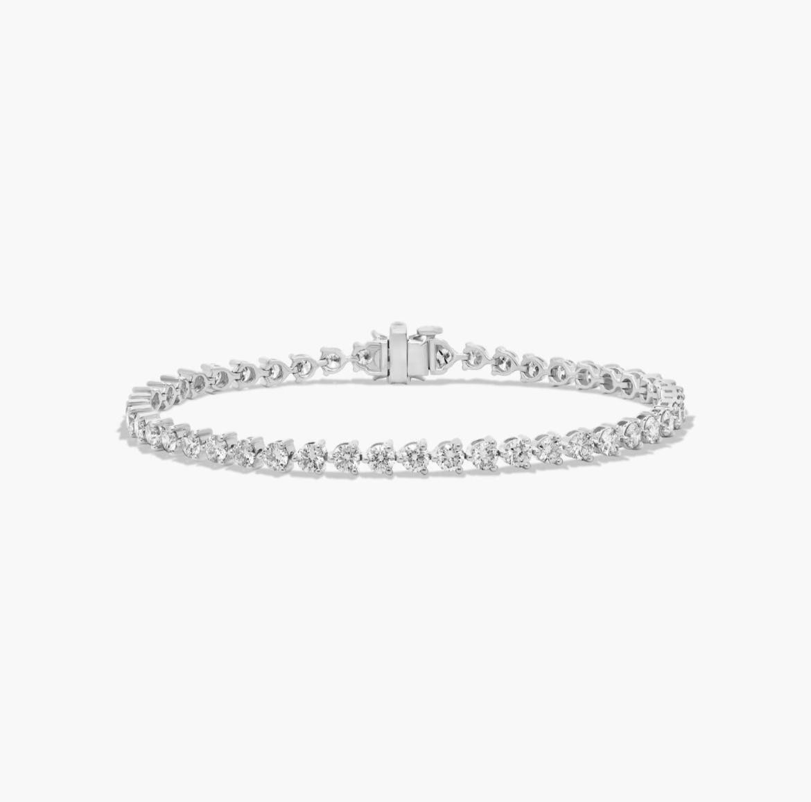 Flower Clasp Tennis Bracelet With 5 CTW simulated Diamonds In 14K White Gold gallery