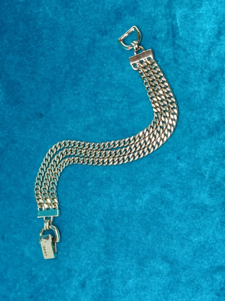 DKNY Gold Tone Triple Chains Bracelet. 1712