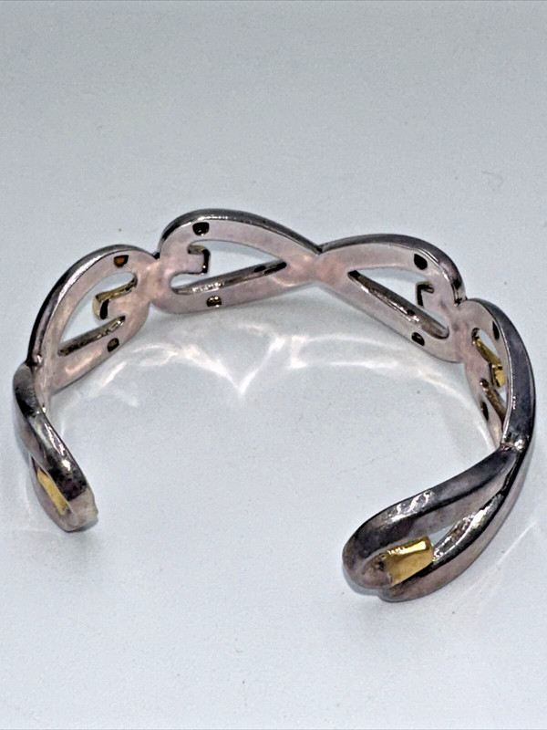 Vintage "BEST" Brand Silver And Gold Toned Open Work InFinity Cuffed Bracelet gallery