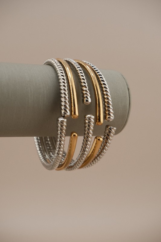 Chic two tone cuff bracelet with cross over design. gallery