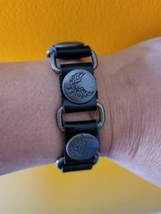 Punk style synthetic leather bracelet with circular metal parts an eagle emblem