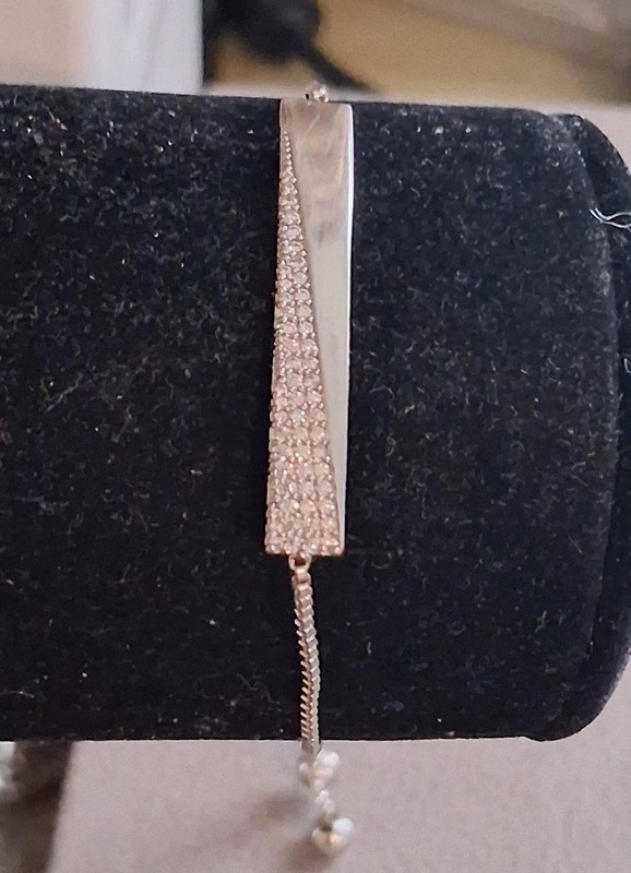 Silverplated bolo bracelet w/cubic zirconia pave-set accent stones. Adj. 7-8" gallery