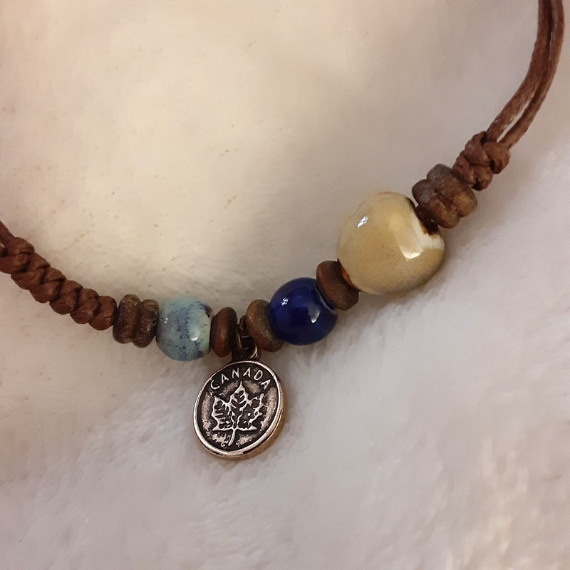 Handmade beaded string bracelet small Canada charm adjustable gallery