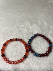 bracelets – green glass, or stone in green, Nikki in red and red/blue Crystal