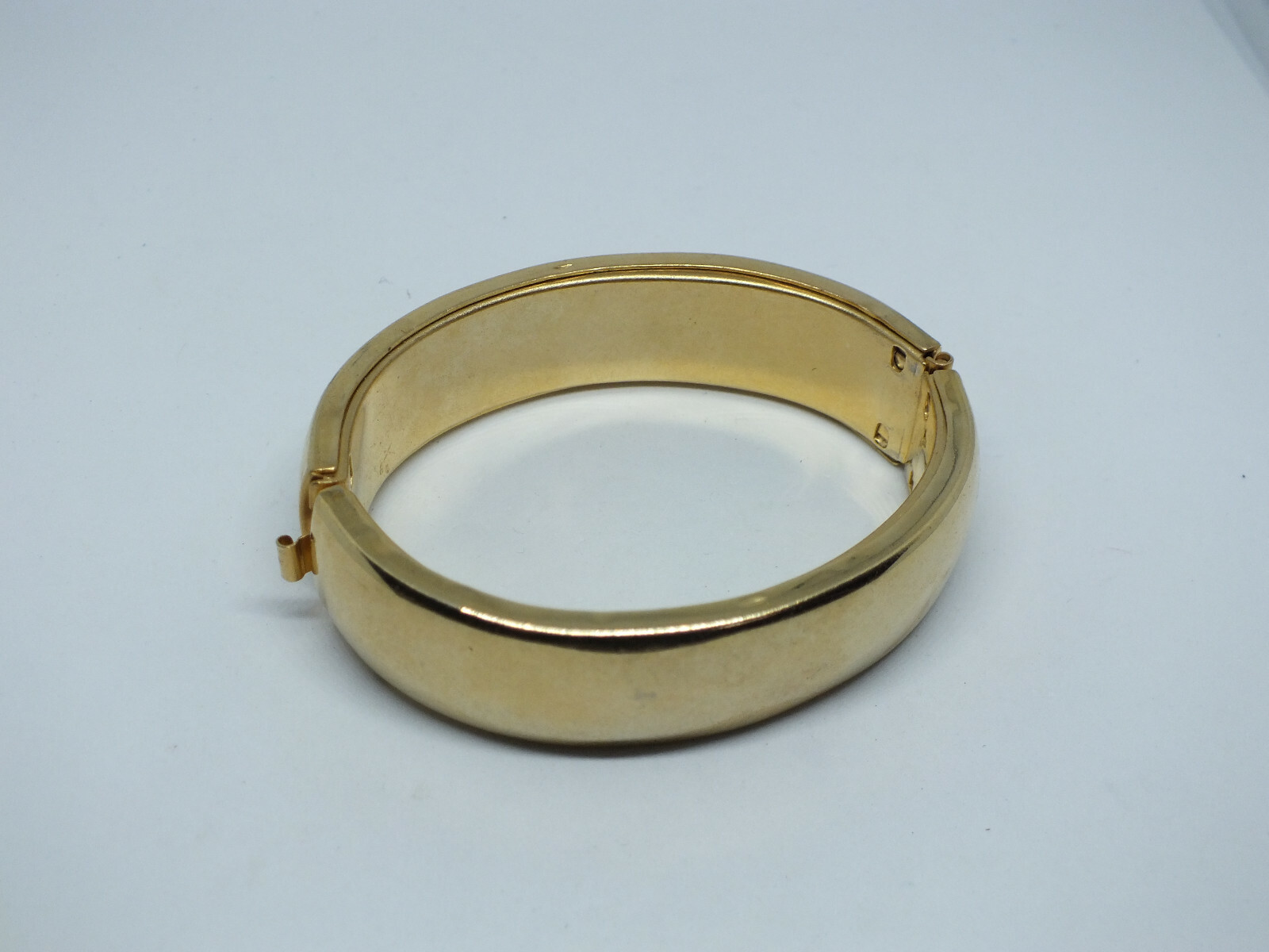 Beautiful Clasp Bracelet Gold Tone Smooth Finish 3/4" Wide x 2 1/2" Across ID gallery