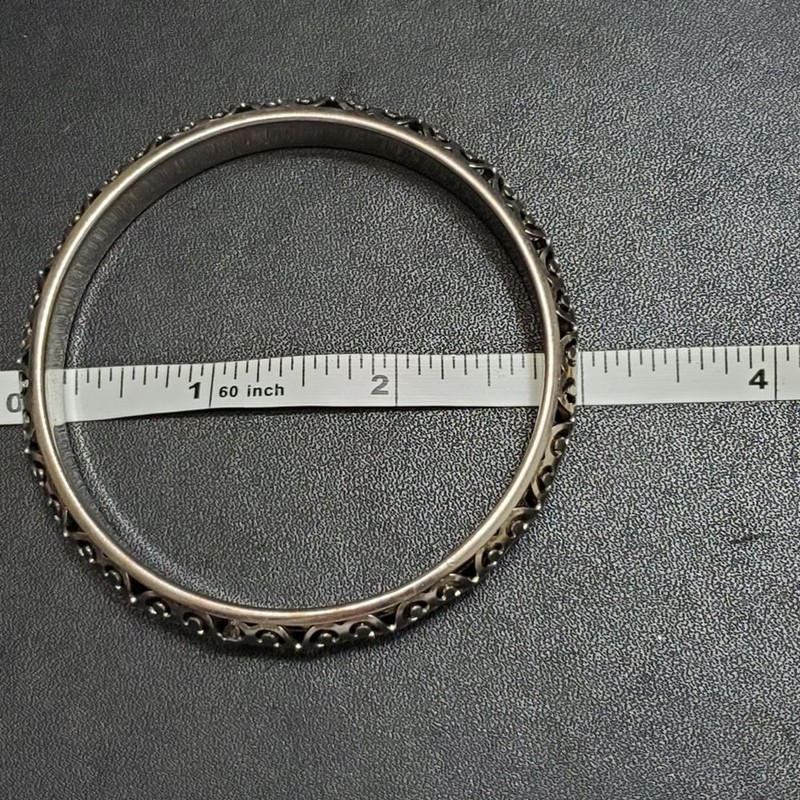 Silver tone filigree bangle bracelet Approx 8" gallery