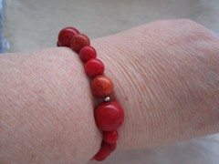 Red Coral, plastic bead reds, stretch bracelet. 7 1/2 to 8 inch SPT22-3