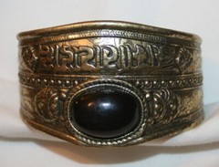 Striking Black Oval Swirls & Crests Brasstone Cuff Bracelet