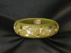 Green And Clear Lucite Chunky Bangle With Embedded Clover Emblems